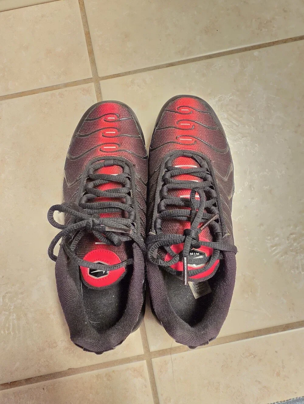 Nike Air Max Plus Black with Red and Yellow Accents